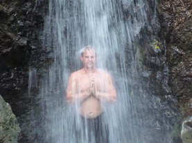 meditating under a waterfall